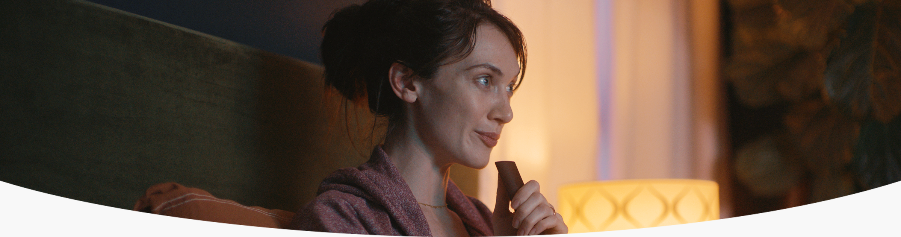 Person speaking into Fire stick with Alexa Voice command